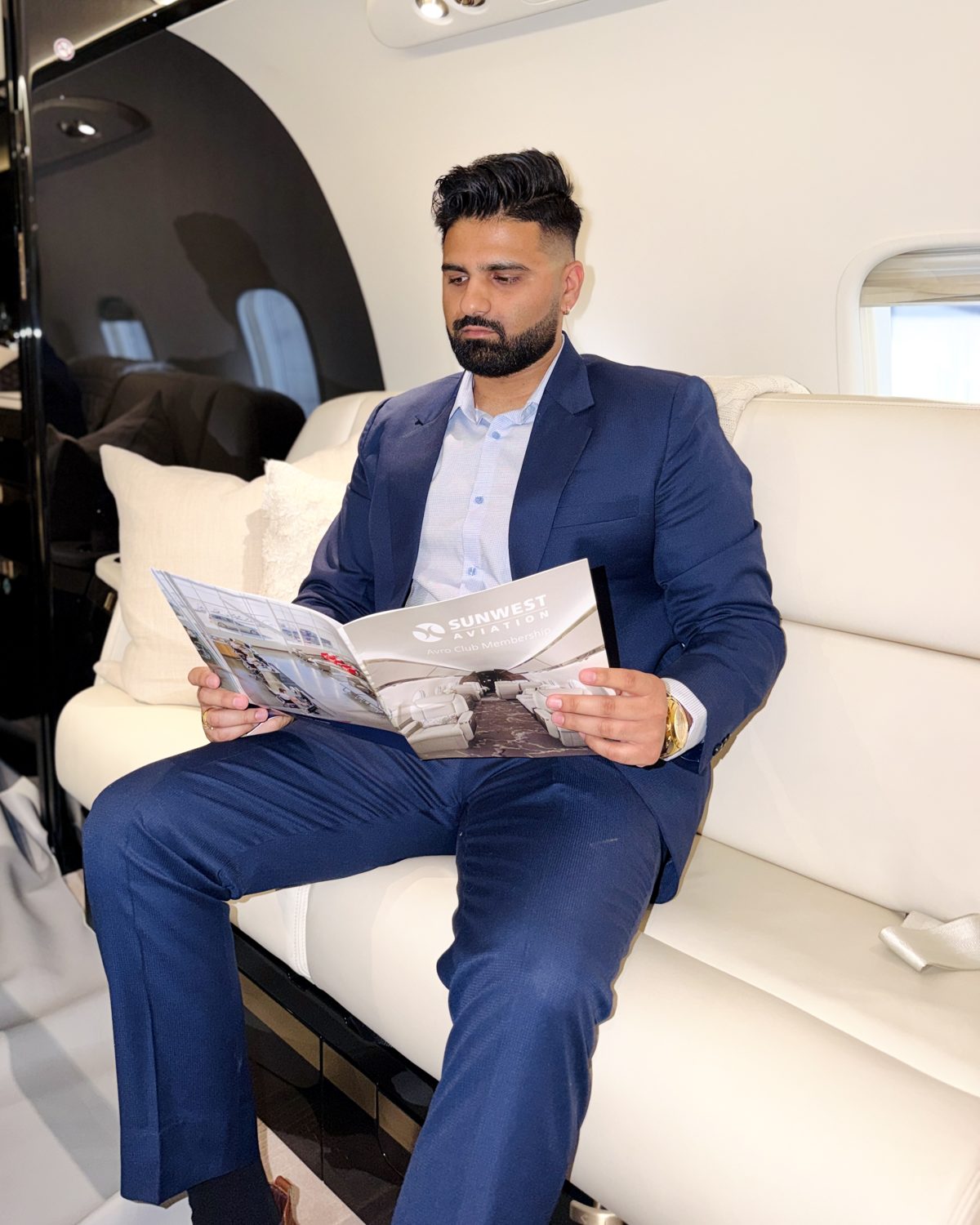 Mohit, founder of Insured by Mohit, in a navy suit